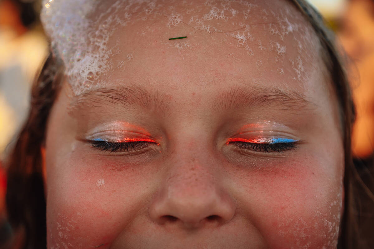 Nayda Silwoski shows off her red, white and blue eyeliner during a Fourth of July bash at Herit ...