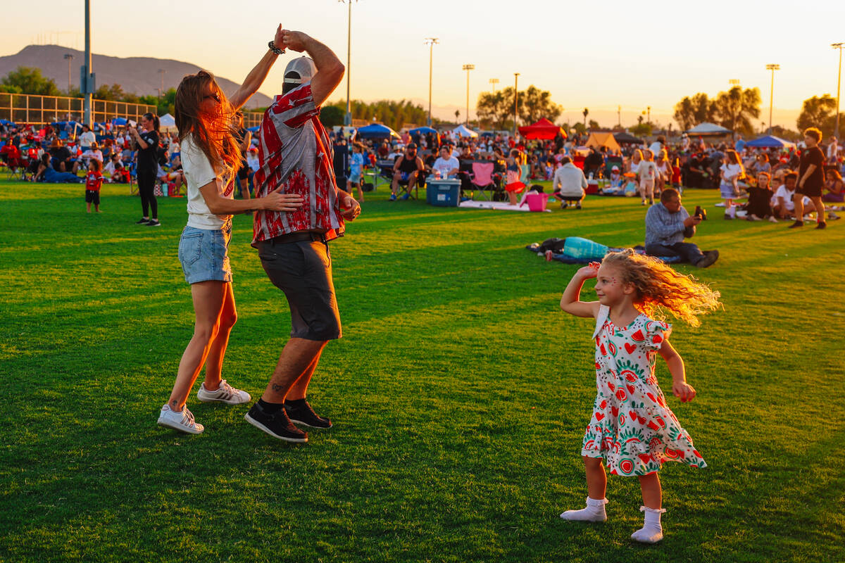 Jennifer Jackson, left, and her husband, Jaykob, dance as their daughter, Lyndon, 4, also dance ...