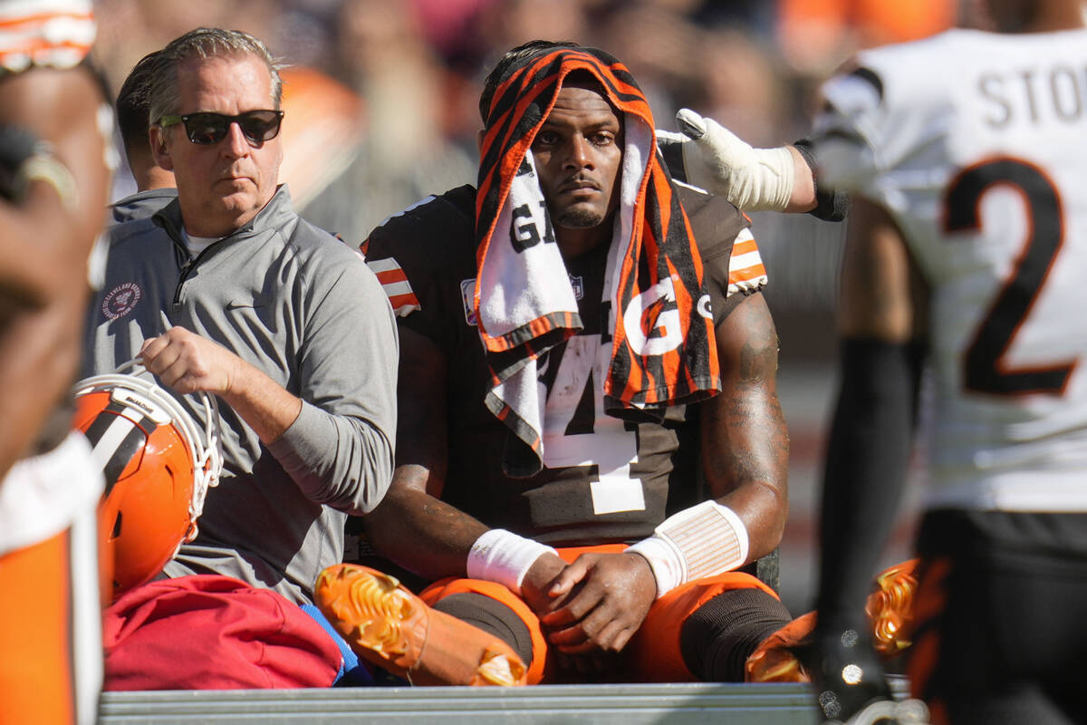 Cleveland Browns quarterback Deshaun Watson (4) is carted off the field after being injured in ...
