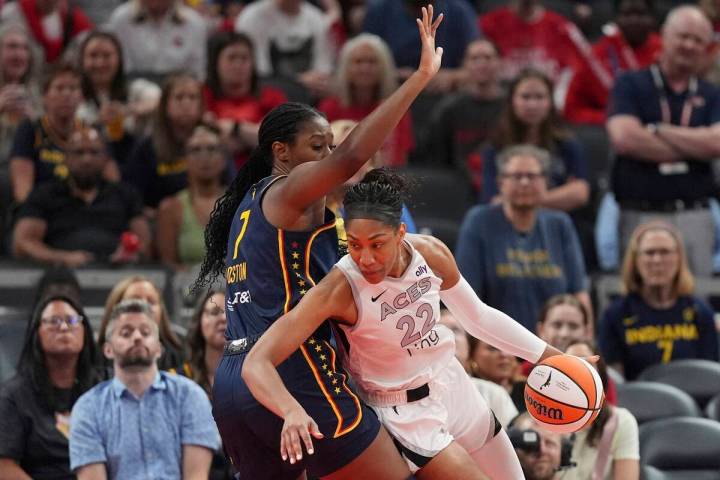 Las Vegas Aces' A'ja Wilson (22) goes to the basket against Indiana Fever's Aliyah Boston (7) d ...