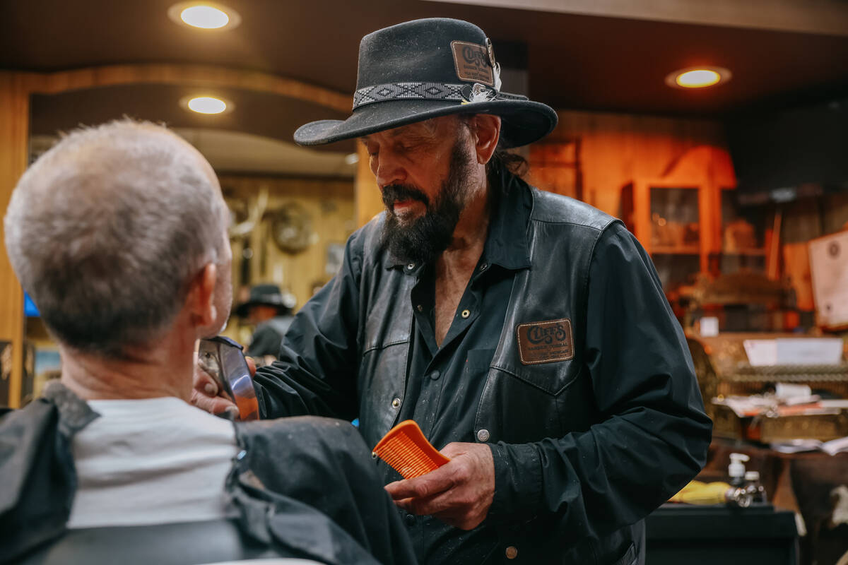 Cliff Wolosin cuts hair at his business, Cliff’s Barber Corral, on Saturday, July 5, 2025 alo ...