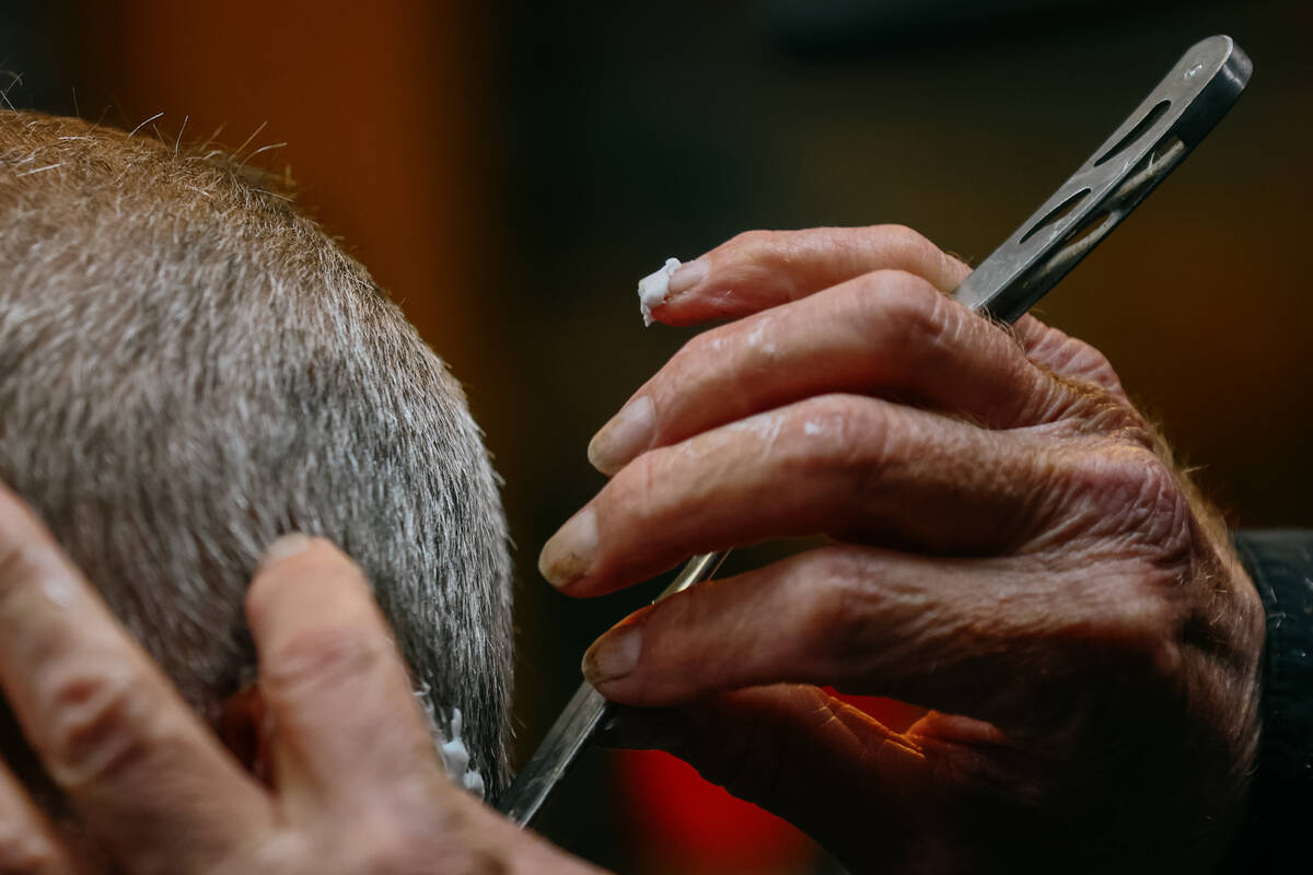Cliff Wolosin cuts hair at his business, Cliff’s Barber Corral, on Saturday, July 5, 2025 alo ...