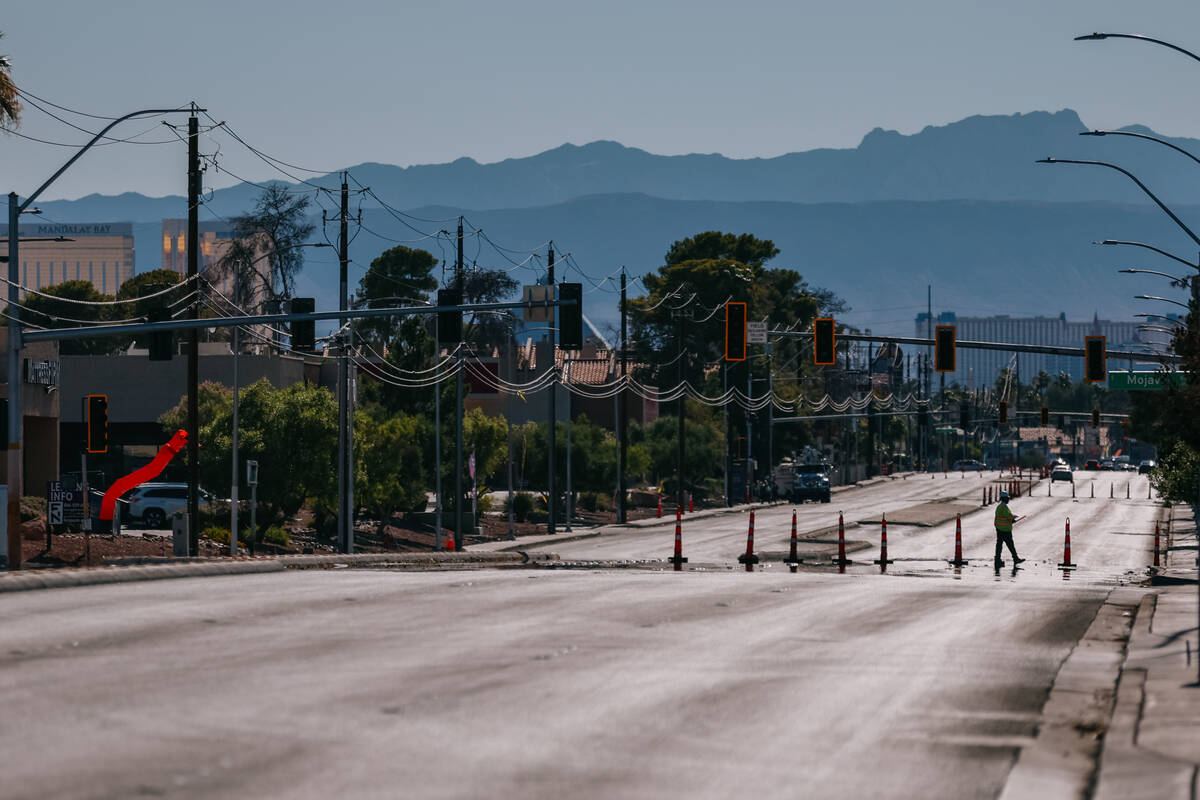A worker walked across a quiet and closed-down portion of Tropicana Avenue, before it reopened ...