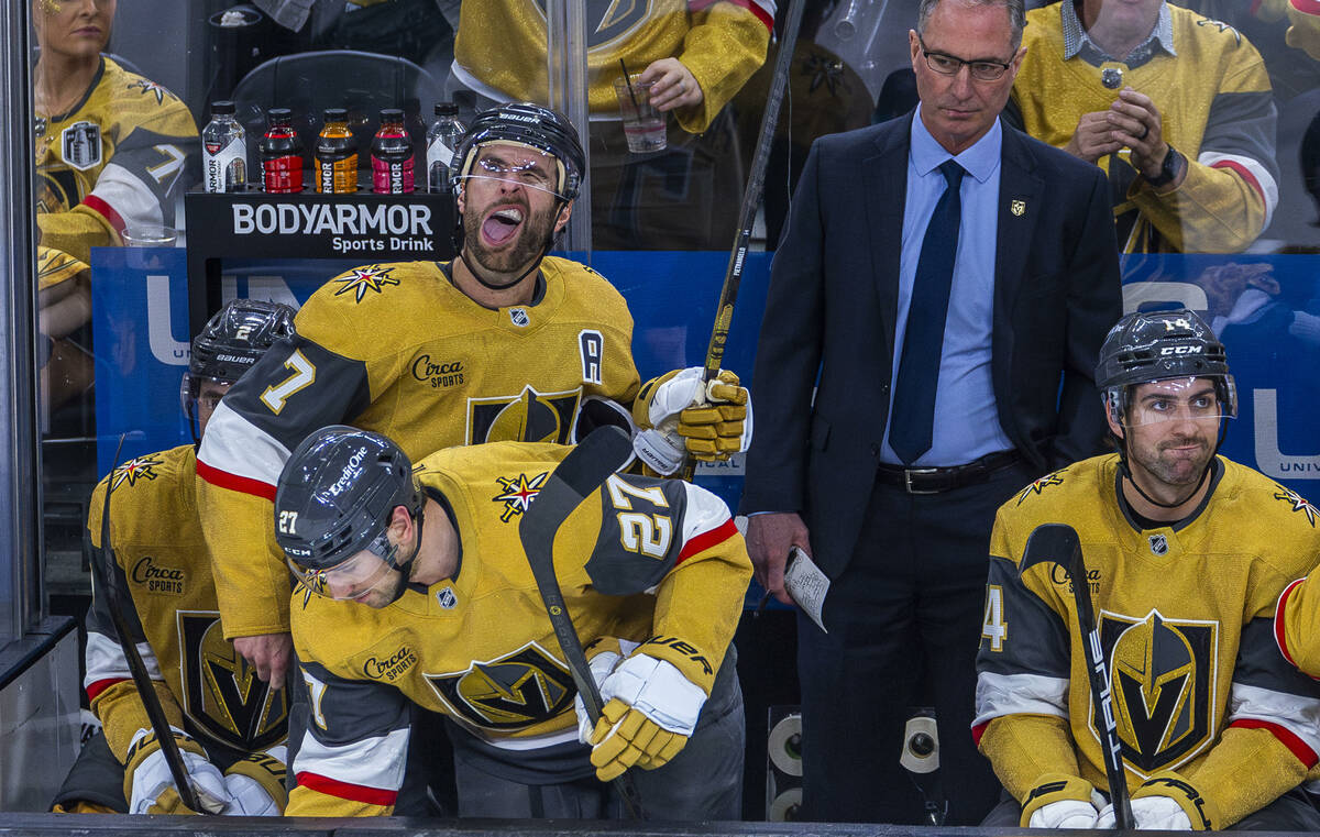 Golden Knights defenseman Alex Pietrangelo (7) opens his mouth after taking a shot to his face ...