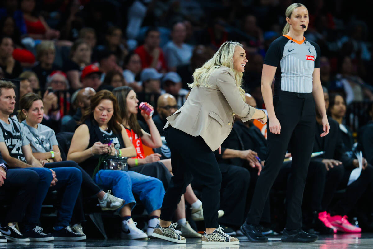 Aces head coach Becky Hammon coaches from the sidelines during a WNBA basketball game between t ...
