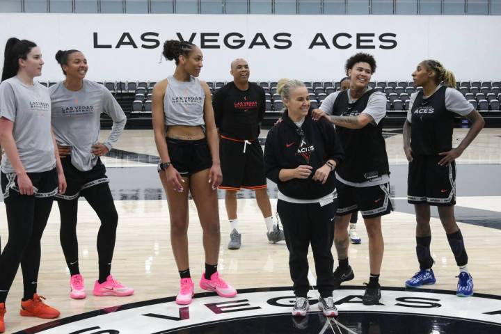 Kierstan Bell grabs head coach Becky Hammon’s shoulders a the end of the Las Vegas Aces ...