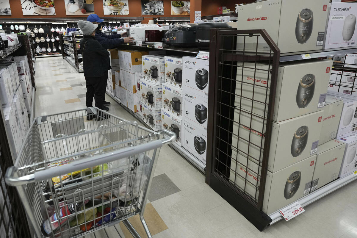 FILE - Shoppers shop electric rice cookers imported from Japan and Korea at the H Mart in Niles ...