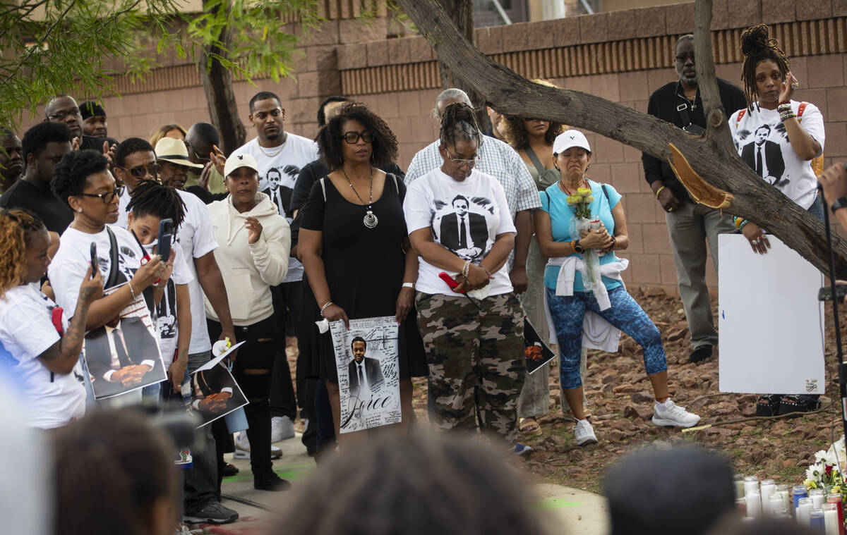 Friends and family look on during a vigil for Joree Odabi along Warm Springs Road near Torrey P ...