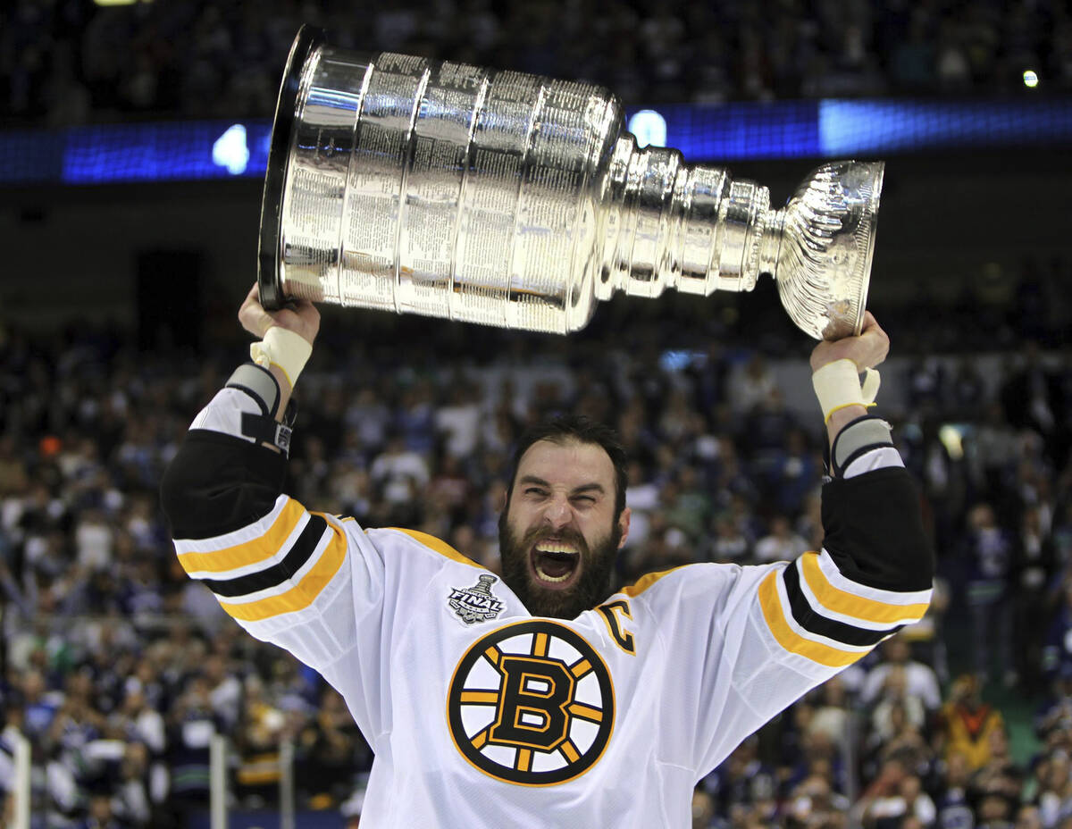 FILE - Boston Bruins' Zdeno Chara, of Slovakia, hoists the cup following the Bruins' 4-0 win ov ...