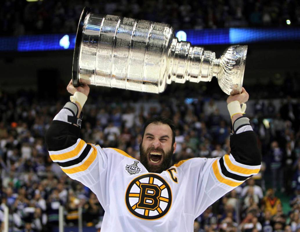 FILE - Boston Bruins' Zdeno Chara, of Slovakia, hoists the cup following the Bruins' 4-0 win ov ...