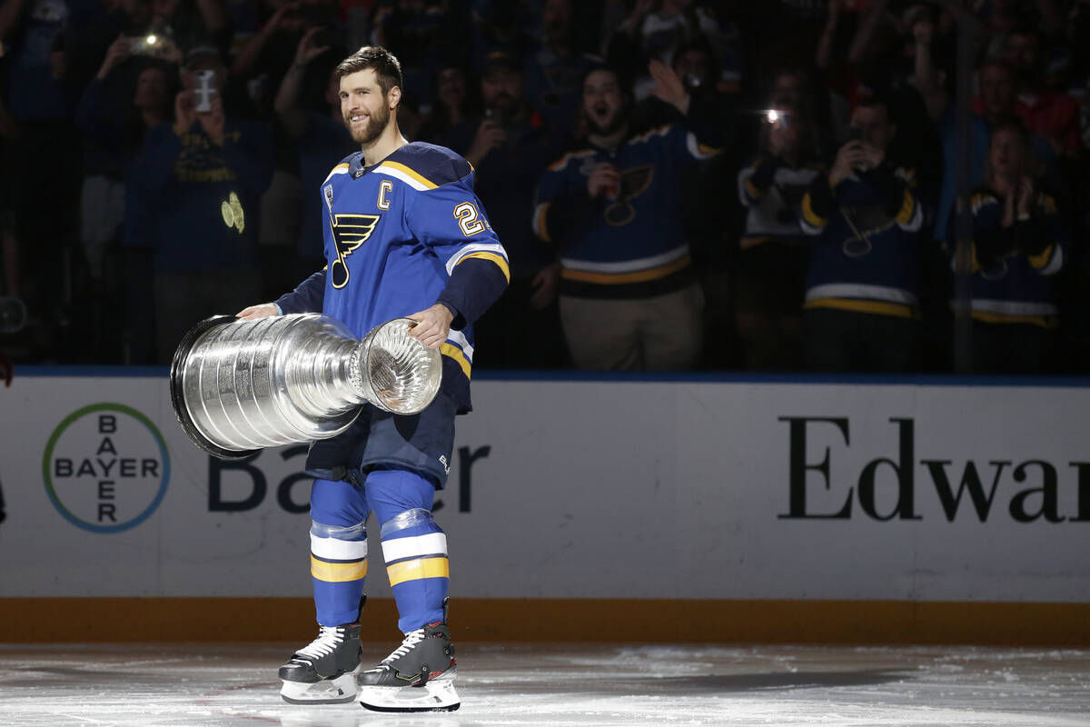 FILE - In this Oct. 2, 2019, file photo, St. Louis Blues captain Alex Pietrangelo lifts the Sta ...
