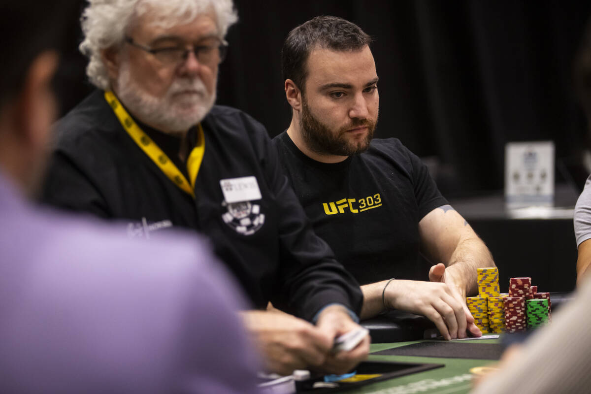 Chad Power reaches for his cards during day 3 of the World Series of Poker Main Event at Horses ...