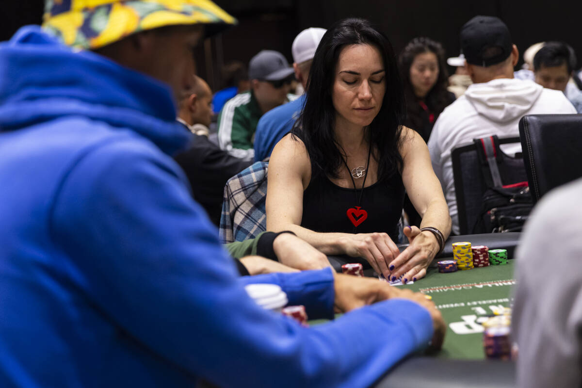 Liv Boeree checks her cards during day 3 of the World Series of Poker Main Event at Horseshoe L ...