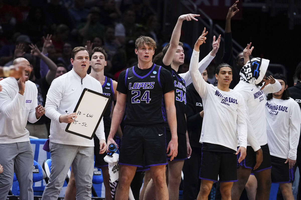 The Grand Canyon bench, including forward Duke Brennan (24), react during the first half agains ...