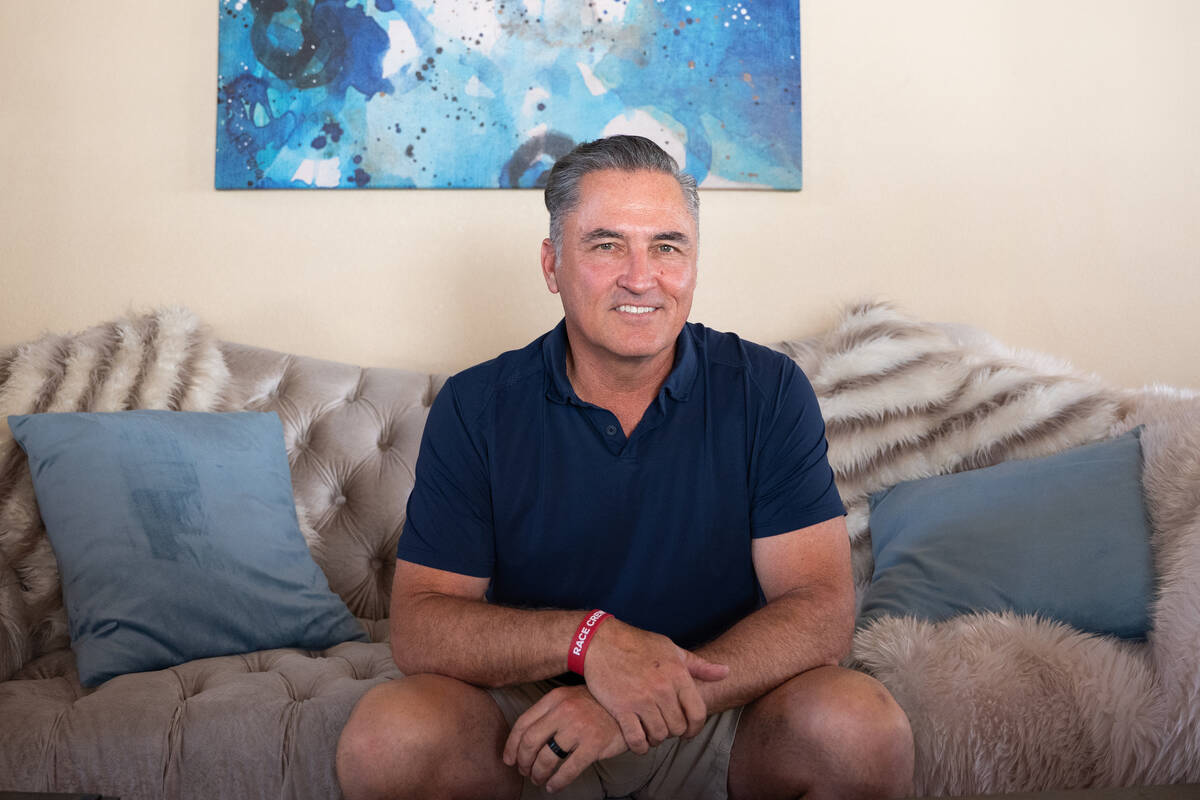 Jimmy Johnson, a retired firefighter and adventurer, sits in his Las Vegas home July 18, 2025. ...
