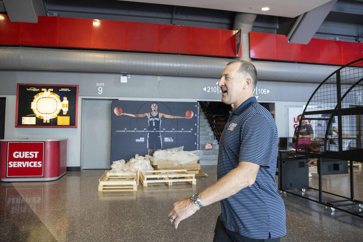 Albert Hall, the co-founder of NBA Summer League, walk through the Thomas & Mack Center as ...