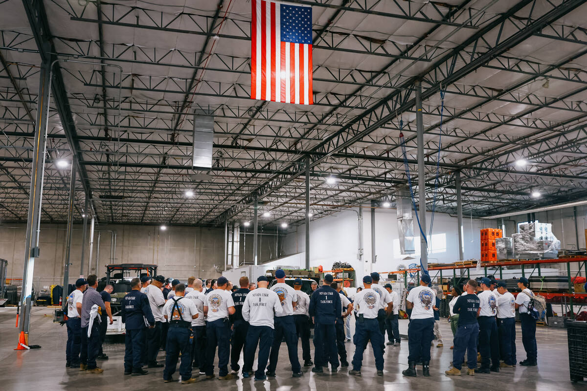 The Nevada Task Force 1 team gathers for a briefing before shipping out to to Texas on Tuesday, ...