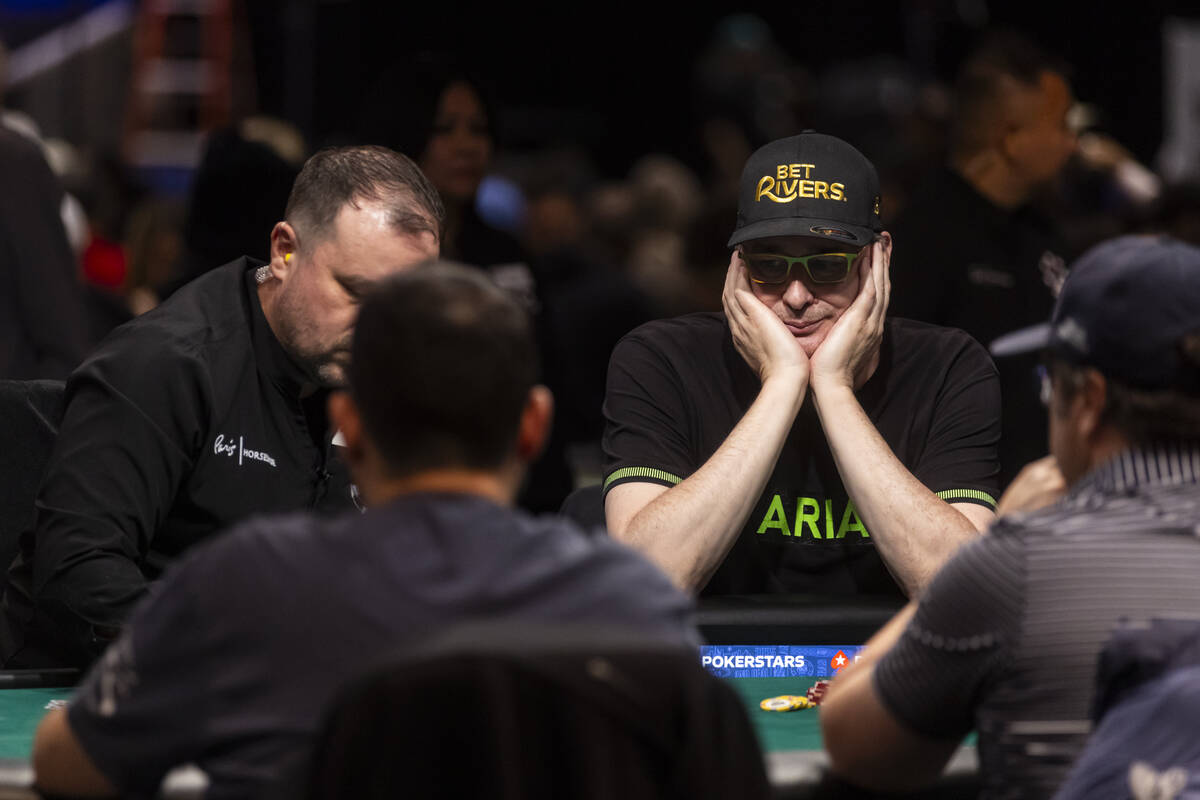 Phil Hellmuth, right, reacts after going all-in pre-flop on a play before getting knocked out d ...