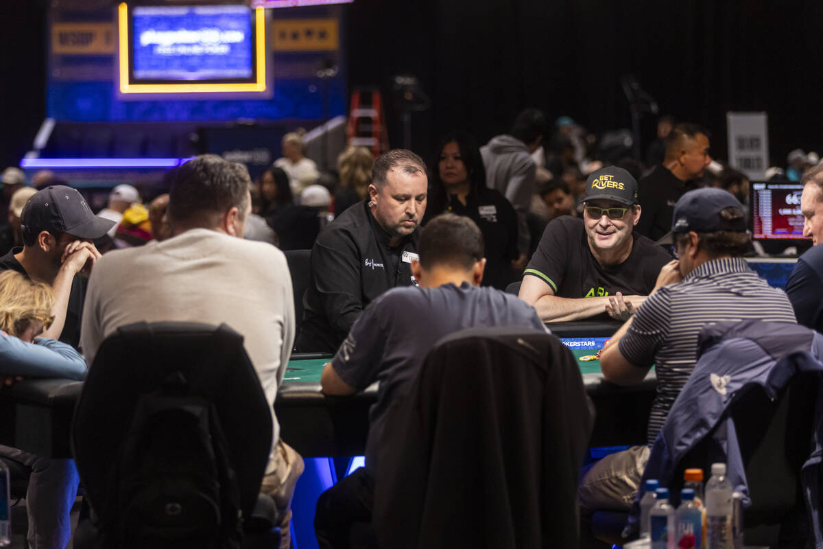 Phil Hellmuth, right, reacts after going all-in pre-flop on a play before getting knocked out d ...