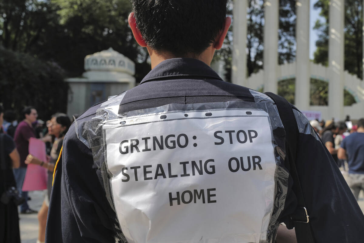 People protest against Americans' gentrification of parts of Mexico City, at Parque Mexico, Fri ...