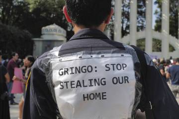 People protest against Americans' gentrification of parts of Mexico City, at Parque Mexico, Fri ...