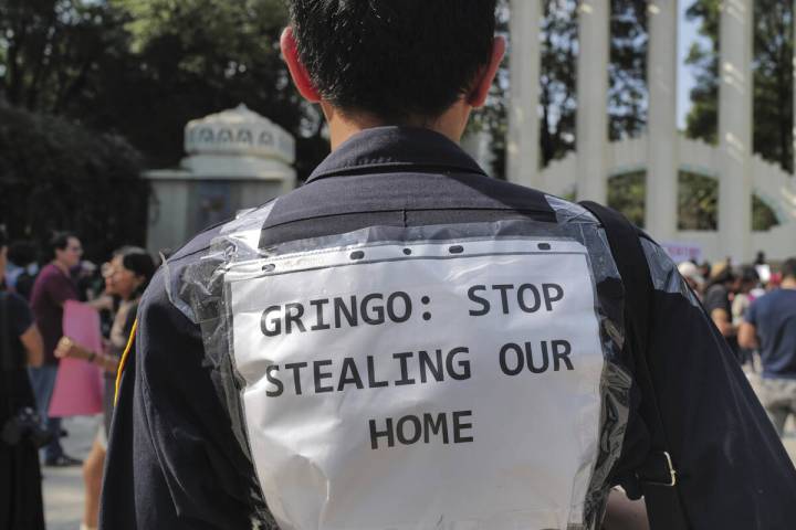 People protest against Americans' gentrification of parts of Mexico City, at Parque Mexico, Fri ...