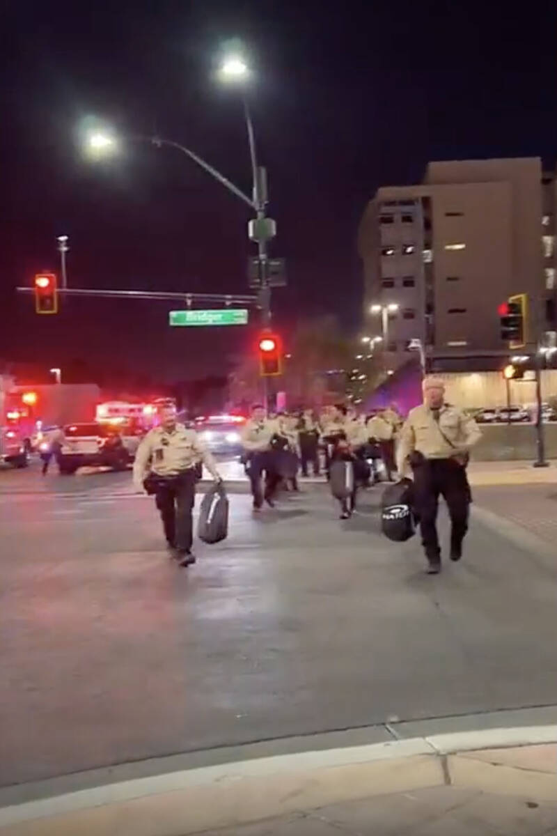 This video screenshot shows Metro officers approaching Karlin Martinez and Cesar Corrales to ma ...