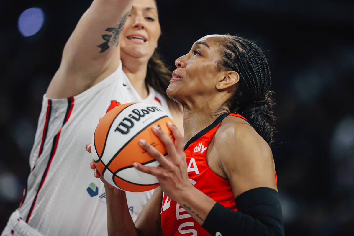 Aces center A'ja Wilson (22) puts up a shot during a WNBA game between the Aces and Washington ...