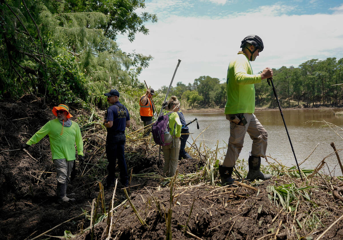 Eric Herr, a volunteer with Search and Support San Antonio, does search and rescue work on the ...