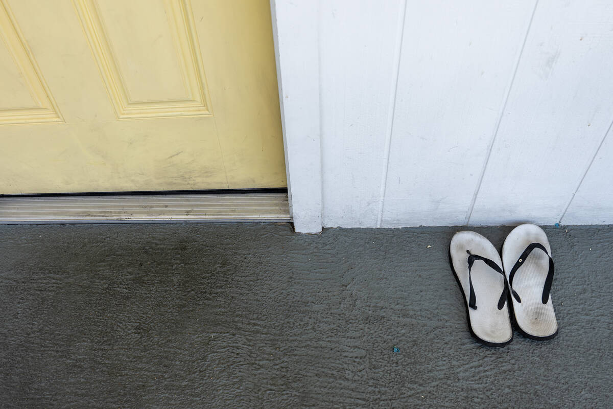 A resident’s flipflops sit outside their door at the Clark County Navigation Center, a conver ...