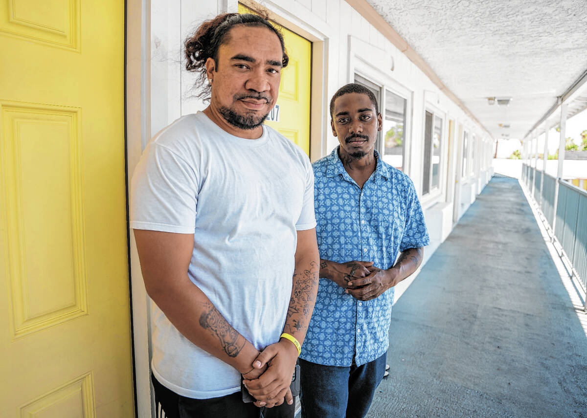 Justin Golden, left, and Steven Martin, roommates at the Clark County Navigation Center, stand ...