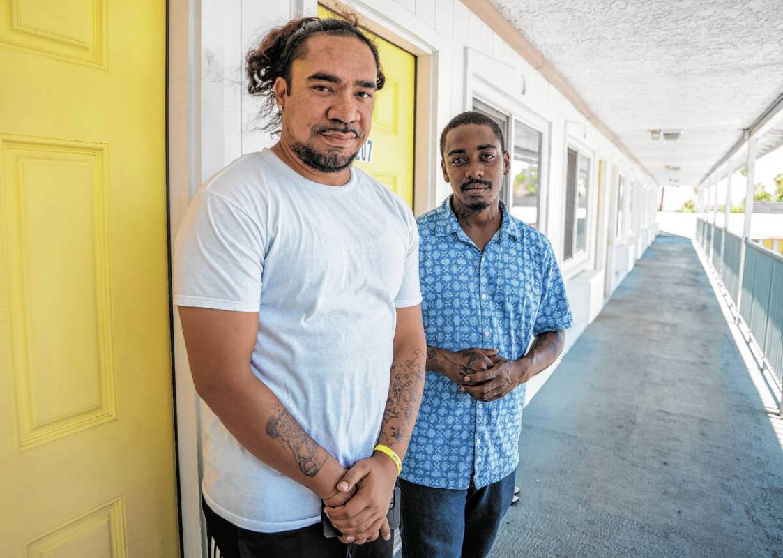 Justin Golden, left, and Steven Martin, roommates at the Clark County Navigation Center, stand ...