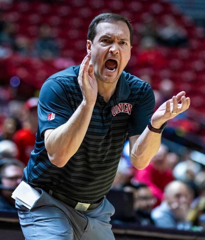 UNLV head coach Kevin Kruger works to motivate his team as they fall behind the Wyoming Cowboys ...