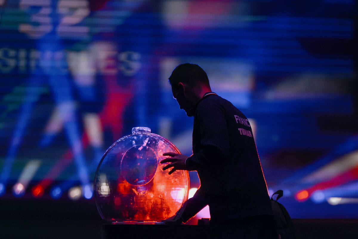 Alexis Lebrun of France grabs a water bottle before a matchup against Yukiya Uda of Japan durin ...