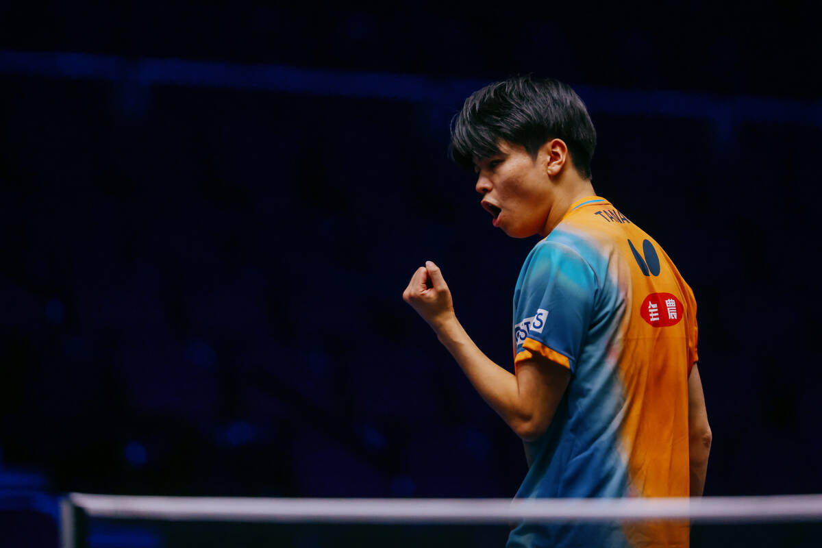Yuta Tanaka celebrates winning a point over Truls Moregard of Sweden during the Men’s Si ...