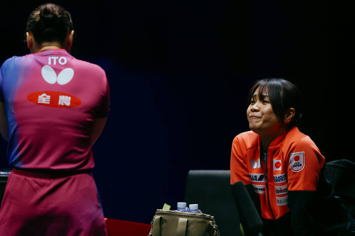 Mima Ito’s coach talks with her during a time out in the Women’s Singles Round of ...