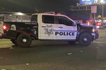 Las Vegas police work at the scene of a fatal shooting in the area of South Eastern Avenue and ...