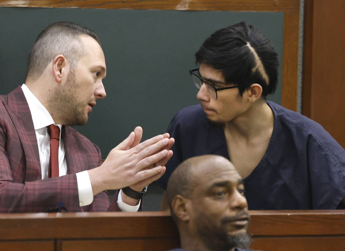 Carlos Blakely, right, a suspect in the Pahrump shooting at a park, listens to his attorney Mic ...