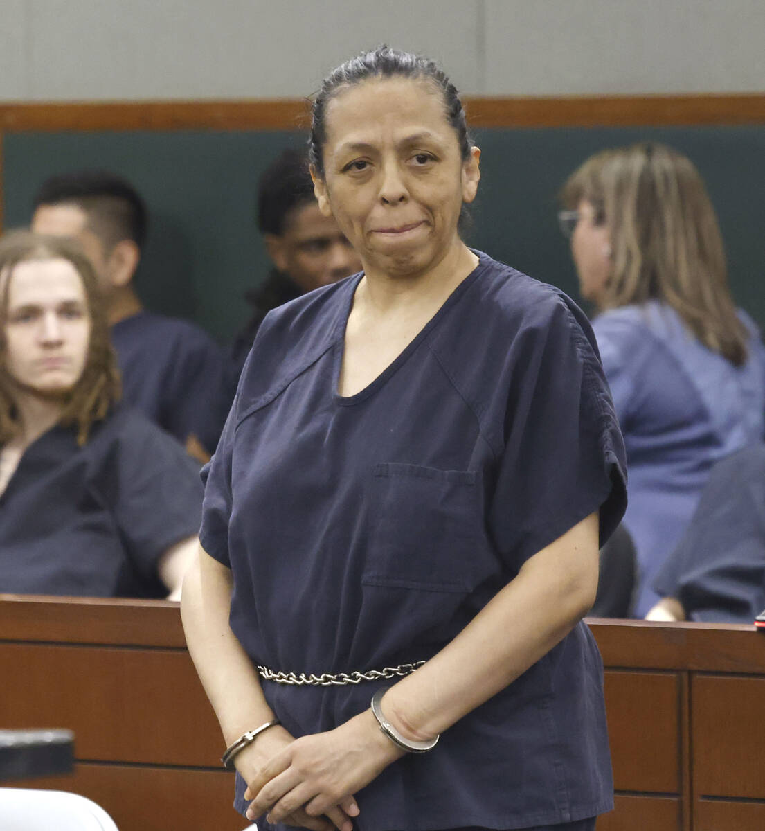 Rita Colon, accused in two fatal stabbings, appears in court during a hearing at the Regional J ...