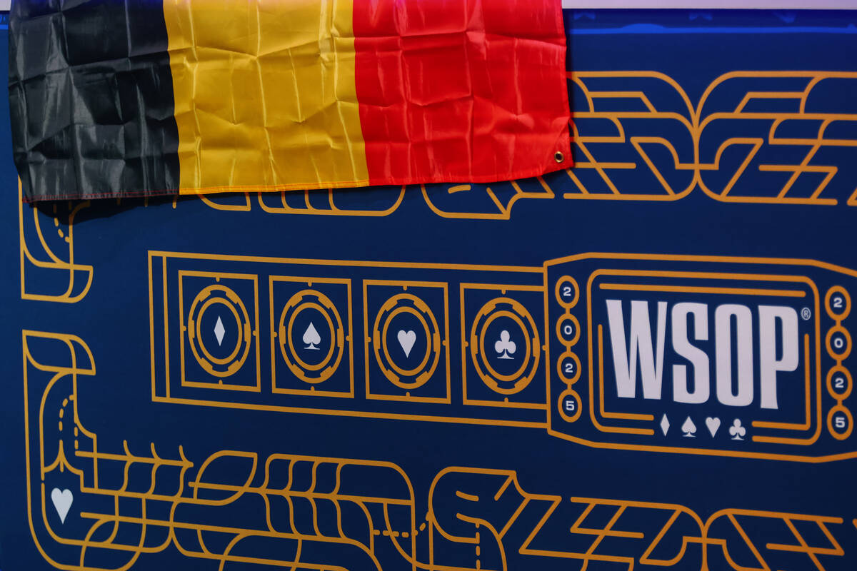 A German flag drapes over the barrier around feature table two at day five of the World Series ...