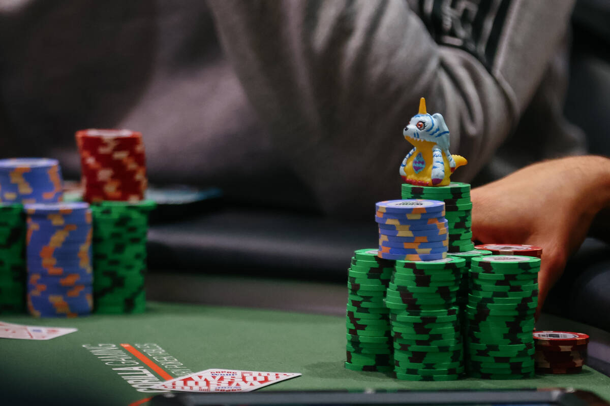 A figurine of the Digimon Gabumon rests atop a player’s chips during day five of the Wor ...