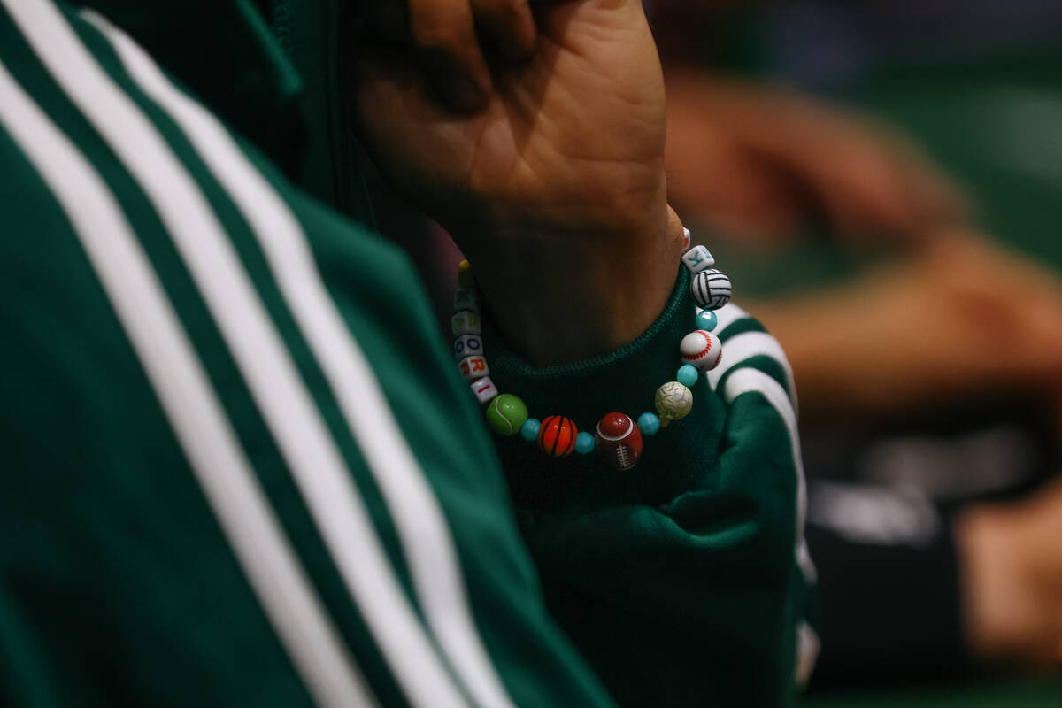 A player wears a sports-themed bracelet while participating in day five of the World Series of ...