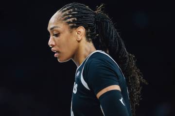 Aces center A'ja Wilson looks down during a WNBA basketball game between the Aces and Los Angel ...