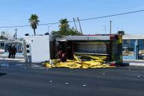 A North Las Vegas fire truck is seen after overturning on Civic Center Drive at Cheyenne Avenue ...