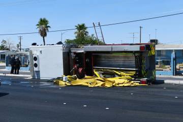 A North Las Vegas fire truck is seen after overturning on Civic Center Drive at Cheyenne Avenue ...