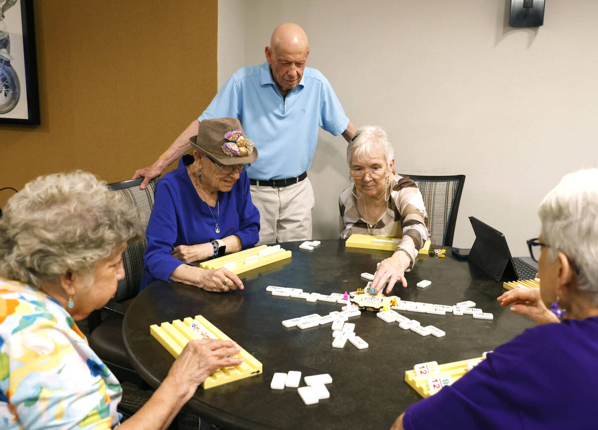 Dr, Richard Berman, center standing, watches as residents at the retirement community Carnegie ...