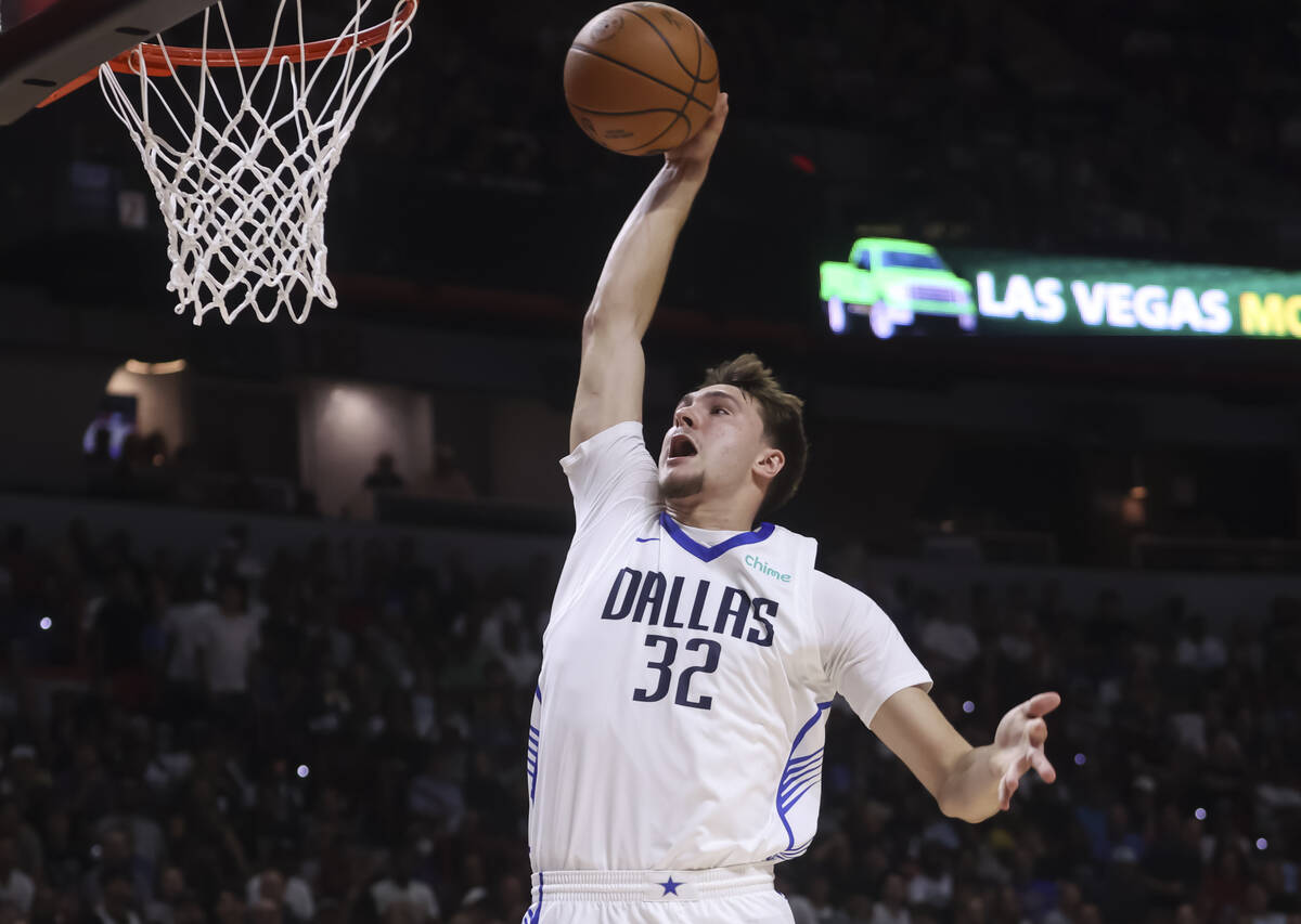 Dallas Mavericks Cooper Flagg (32) goes to the basket for a dunk against the Los Angeles Lakers ...