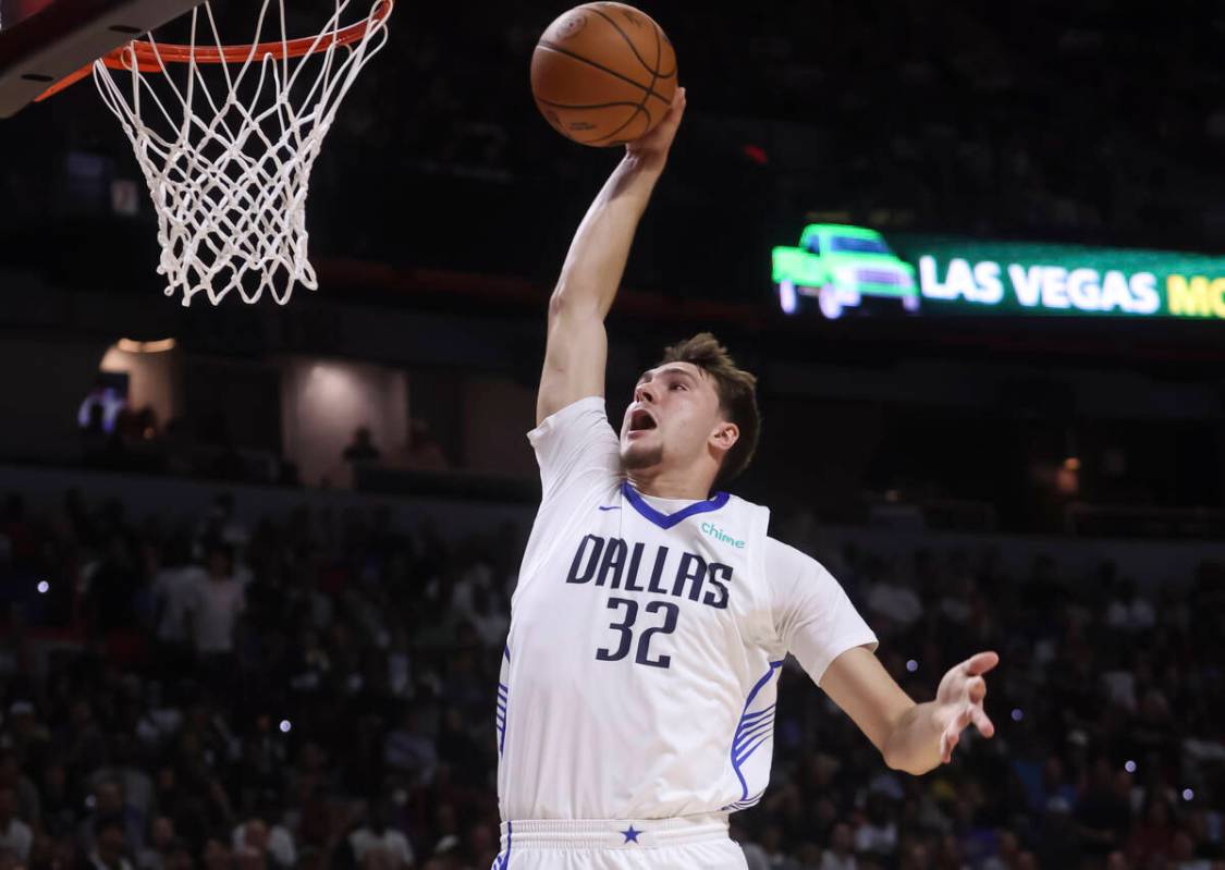 Dallas Mavericks Cooper Flagg (32) goes to the basket for a dunk against the Los Angeles Lakers ...