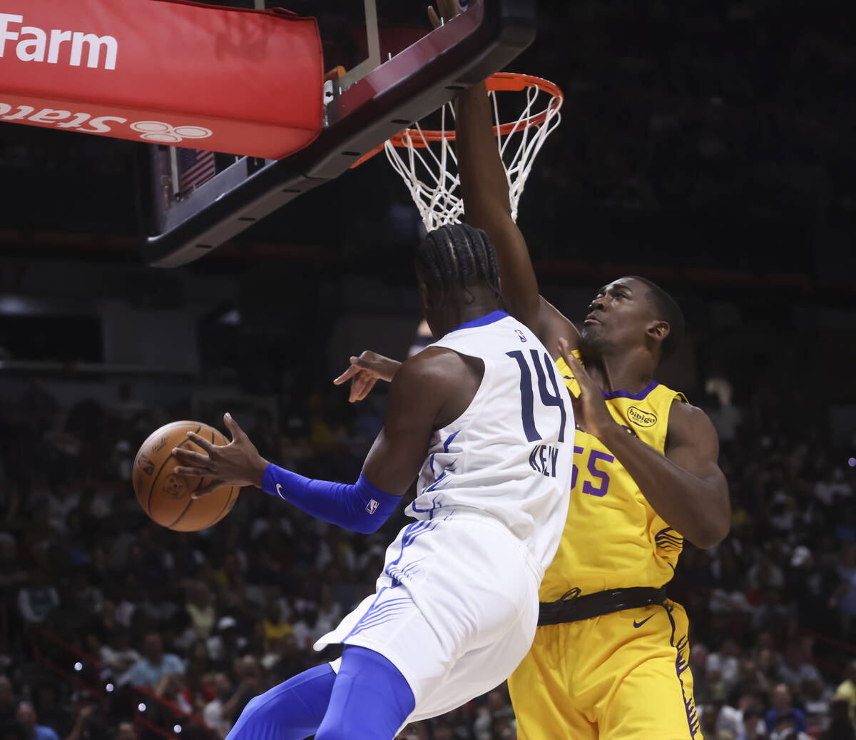 Los Angeles Lakers center Trey Jemison III (55) blocks Dallas Mavericks guard Miles Kelly (14) ...