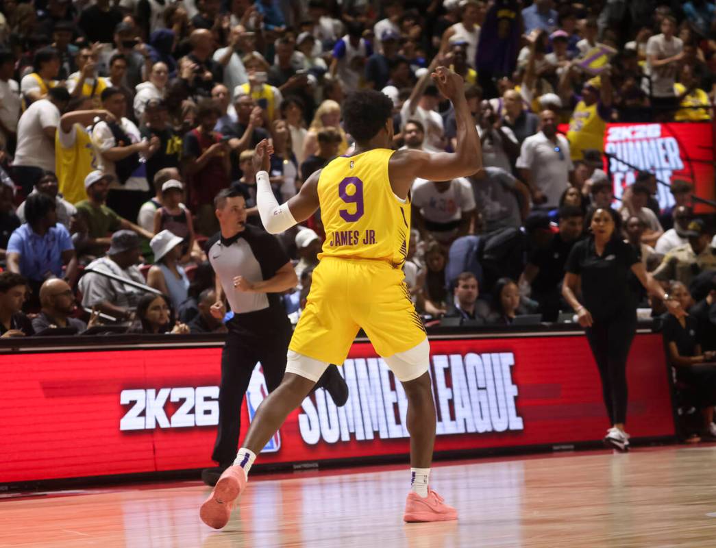 Los Angeles Lakers guard Bronny James (9) reacts after scoring against the Dallas Mavericks in ...